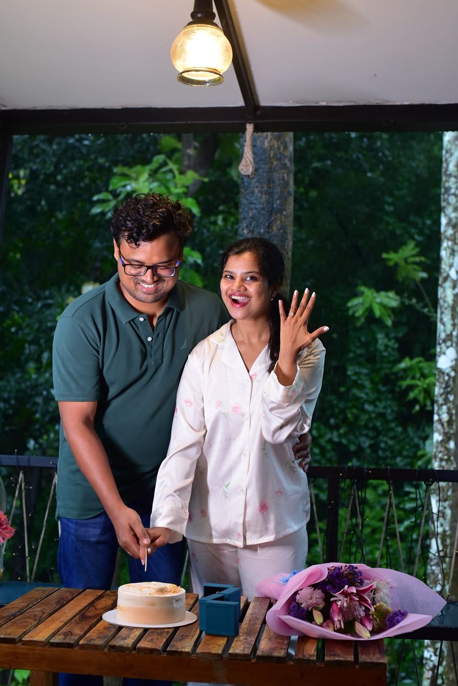 Pooja showing her ring and laughing