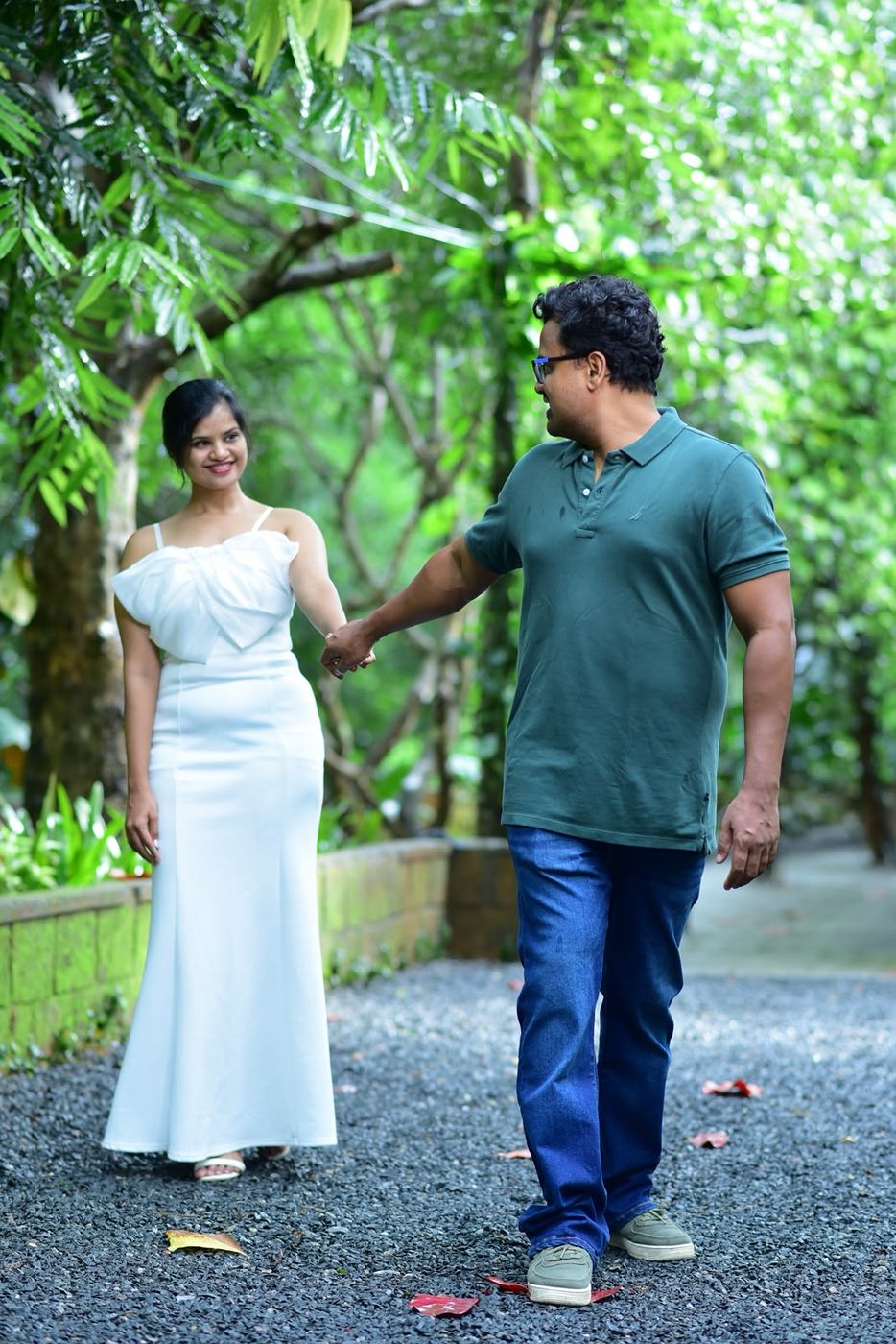 Walking hand in hand through a garden
